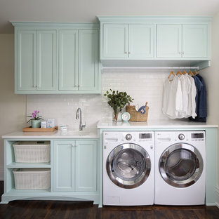 Inspiration for a medium sized classic single-wall separated utility room in Nashville with a submerged sink, turquoise cabinets, engineered stone countertops, dark hardwood flooring, a side by side washer and dryer, brown floors, white worktops, recessed-panel cabinets and beige walls.