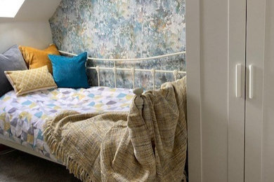 Design ideas for a small contemporary guest and grey and teal bedroom in Devon with multi-coloured walls, carpet, grey floors and wallpapered walls.