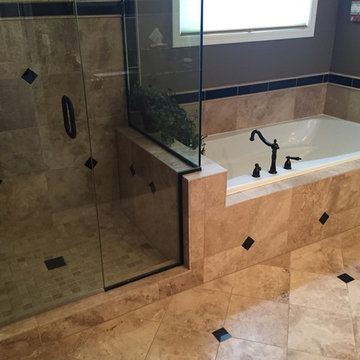 Custom Travertine Bathroom with Black Galaxy Accents