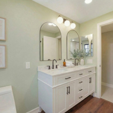 Irvine Master Bathroom Remodel Featuring Soft Green Walls & Lighting