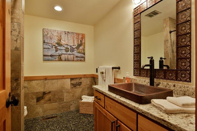 Inspiration for a mid-sized rustic kitchen remodel in Seattle with shaker cabinets, light wood cabinets, granite countertops, a drop-in sink, beige backsplash and stone slab backsplash