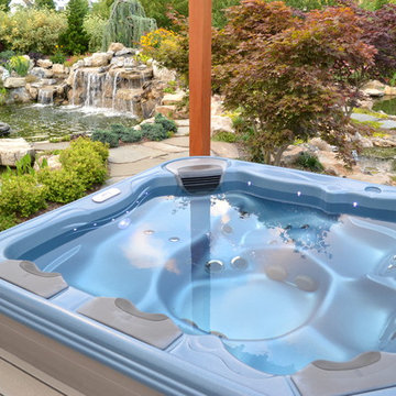 Bullfrog spa set into a Trex deck with and awesome view of two ecosystem ponds