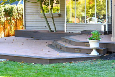 Design ideas for a large contemporary backyard deck in Seattle with no cover.