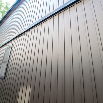 Deep Bronze Vertical Metal Siding with Black Exterior Trim | East York