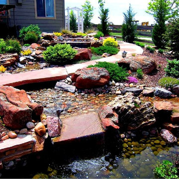Waterfall source which cascades down 5 tiers before entering the Koi pond