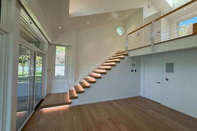 Staircase - mid-sized modern wooden straight staircase idea in Detroit