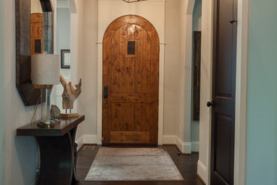 Inspiration for a mid-sized timeless dark wood floor and brown floor entryway remodel in Nashville with gray walls and a dark wood front door