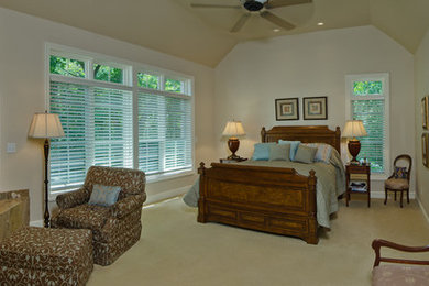 Example of a mid-sized classic master carpeted bedroom design in Other with white walls, a corner fireplace and a tile fireplace