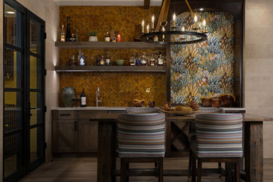 Inspiration for a mediterranean home bar remodel in Denver