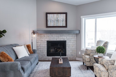 Inspiration for a transitional open concept living room remodel in Other with a corner fireplace and a brick fireplace