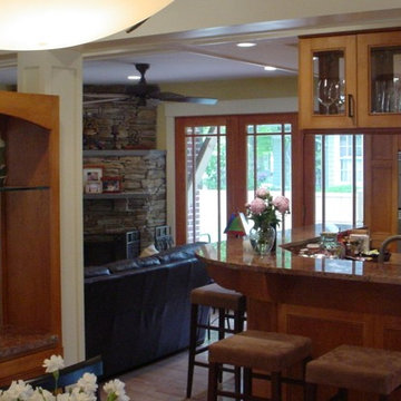 Open Plan unifies Kitchen, Bar, and Den with Rear Deck and Patio