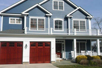 Mid-sized traditional blue three-story wood exterior home idea in DC Metro with a shingle roof