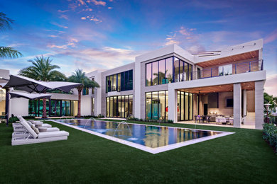 Photo of a contemporary two-storey house exterior in Miami.
