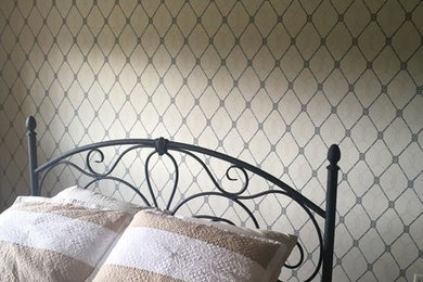 Example of a transitional bedroom design in Milwaukee