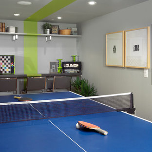 This is an example of a contemporary fully buried basement in Toronto with grey walls.