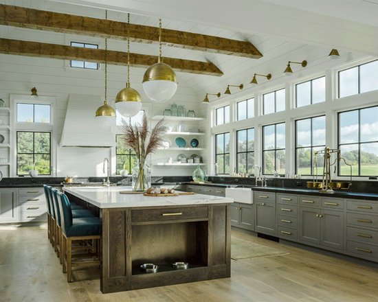 Farmhouse kitchen photos - Example of a country l-shaped light wood floor kitchen design in Burlington with a farmhouse sink, shaker cabinets, gray cabinets and an island