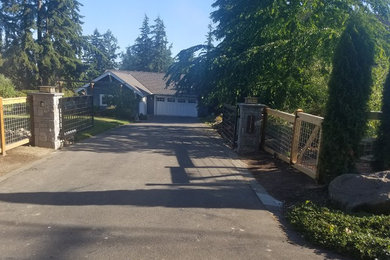 Inspiration for a mid-sized craftsman front yard concrete paver driveway in Seattle.