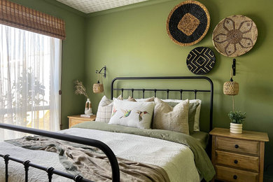 Photo of a mid-sized country guest bedroom in Melbourne with green walls, carpet, no fireplace, grey floor, wallpaper and decorative wall panelling.