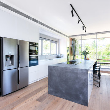 White Industrial Kitchen with Concrete Island Benchtops