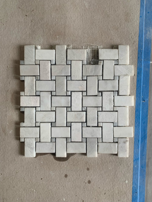 Grout bleeding into marble tiles