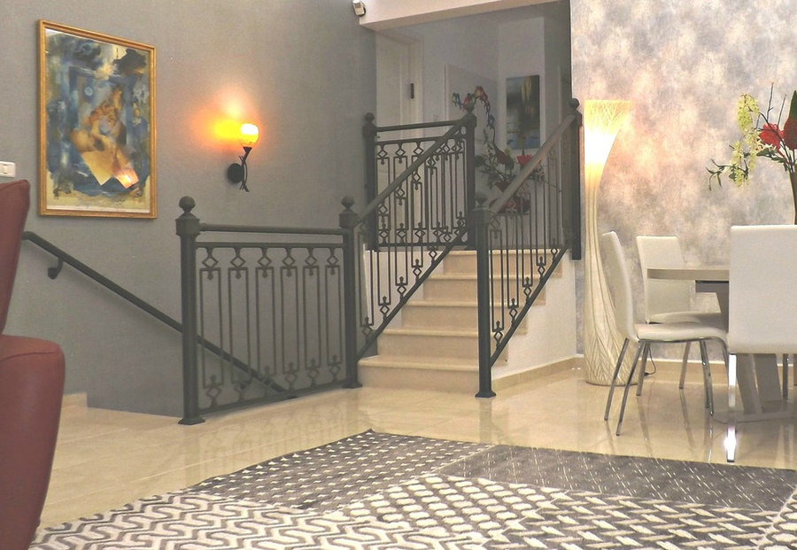view from salon onto stairs to 2 other floors