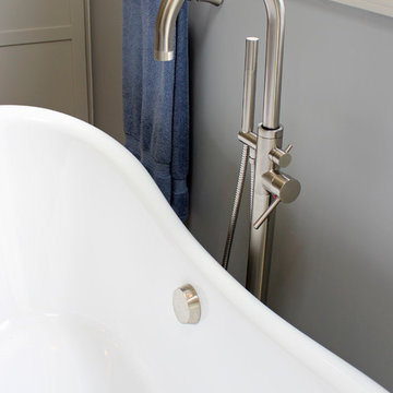 Gray Vanity with Freestanding Tub and Tiled Walkin Shower