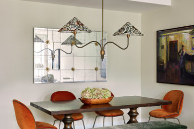 Inspiration for a mid-sized transitional medium tone wood floor and brown floor dining room remodel in New York with beige walls