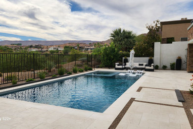 Example of a mid-sized minimalist backyard stone and rectangular pool design in Las Vegas