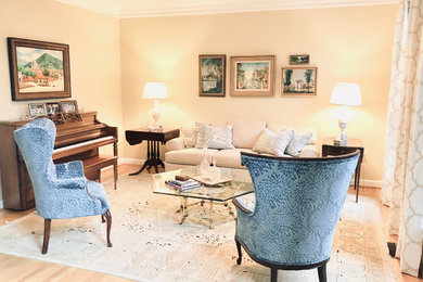 Inspiration for a mid-sized transitional enclosed light wood floor and beige floor living room remodel in DC Metro with a music area, yellow walls, no fireplace and no tv