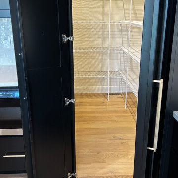 Black and Maple Wheat Kitchen with Brass Banded Hood