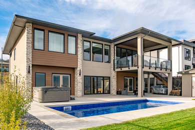 Example of a transitional home design design in Vancouver