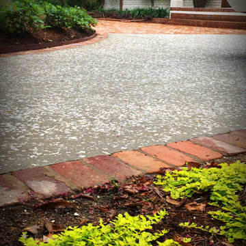 Concrete motor court seeded with oyster shell