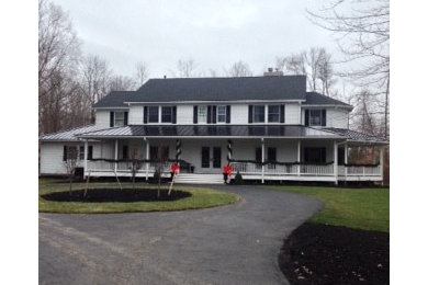 Example of a large minimalist white two-story exterior home design in Columbus with a hip roof