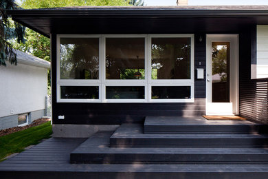 Example of an eclectic exterior home design in Edmonton