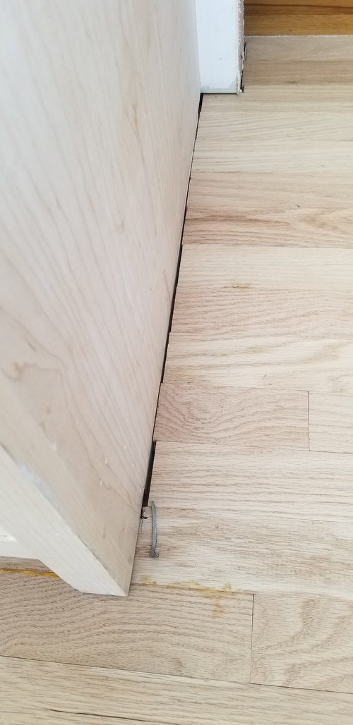 Question About Cabinet End Wood Floor, Do You Put Laminate Flooring Under Cabinets