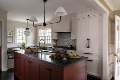 Eat-in kitchen - transitional galley dark wood floor and brown floor eat-in kitchen idea in Minneapolis with an undermount sink, recessed-panel cabinets, white cabinets, multicolored backsplash, paneled appliances, an island and black countertops