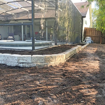 Retaining wall to prevent erosion and create planting beds