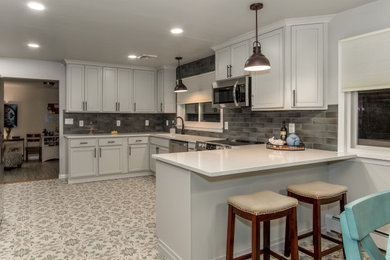 Example of a farmhouse home design design in Other