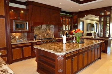 Inspiration for a large mediterranean u-shaped marble floor and white floor eat-in kitchen remodel in Miami with a double-bowl sink, beaded inset cabinets, medium tone wood cabinets, paneled appliances and an island