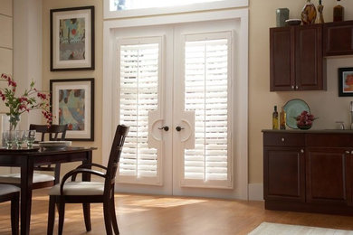 Kitchen/dining room combo - mid-sized traditional light wood floor and brown floor kitchen/dining room combo idea in Other with beige walls and no fireplace