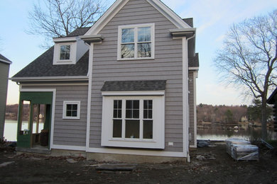 Mid-sized coastal gray two-story vinyl gable roof idea in Boston