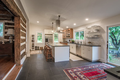 Enclosed kitchen - large transitional u-shaped enclosed kitchen idea in Other with white cabinets, white backsplash, stainless steel appliances and an island