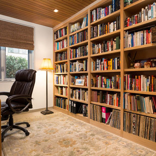 Photo of a medium sized modern home office and library in Los Angeles with a reading nook, white walls, travertine flooring, no fireplace, a freestanding desk and white floors.