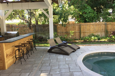 Example of a beach style home design design in Tampa