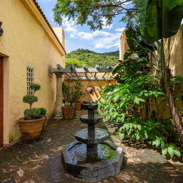 Hacienda Las Tapias - A gallery leads from the library to the water courtyard