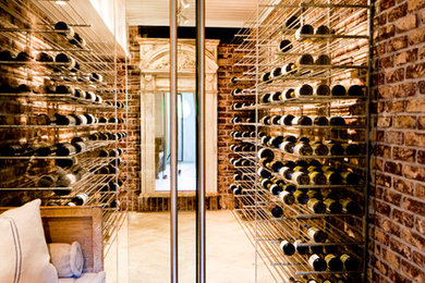 Mid-sized industrial wine cellar in San Diego with travertine floors, storage racks and beige floor.