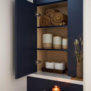 Above the Toilet Built-In Bathroom Cabinetry with Hidden Linen Storage