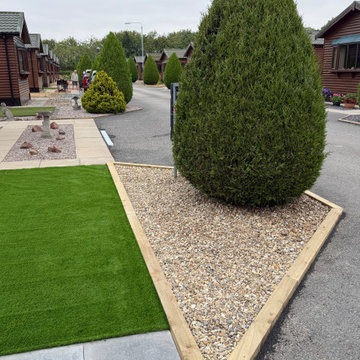 Timber Edged Shingle Bed Beside an Artificial Lawn