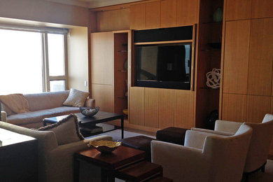 Inspiration for a mid-sized contemporary loft-style medium tone wood floor living room remodel in Chicago with a music area, brown walls, no fireplace and a concealed tv