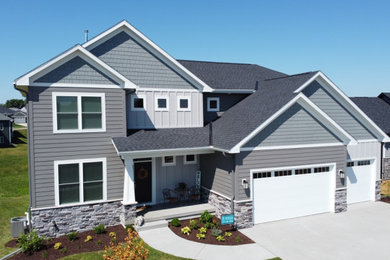 Example of a transitional exterior home design in Cedar Rapids